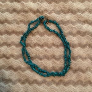 Turquoise colored long beaded necklace. About 34 in long. See pics
